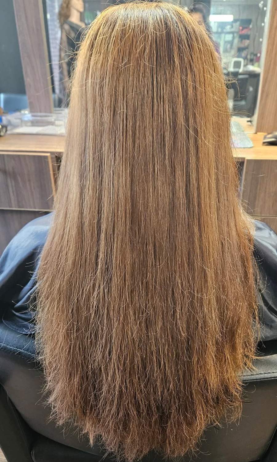 Long hair washed, straightened and finished in the salon