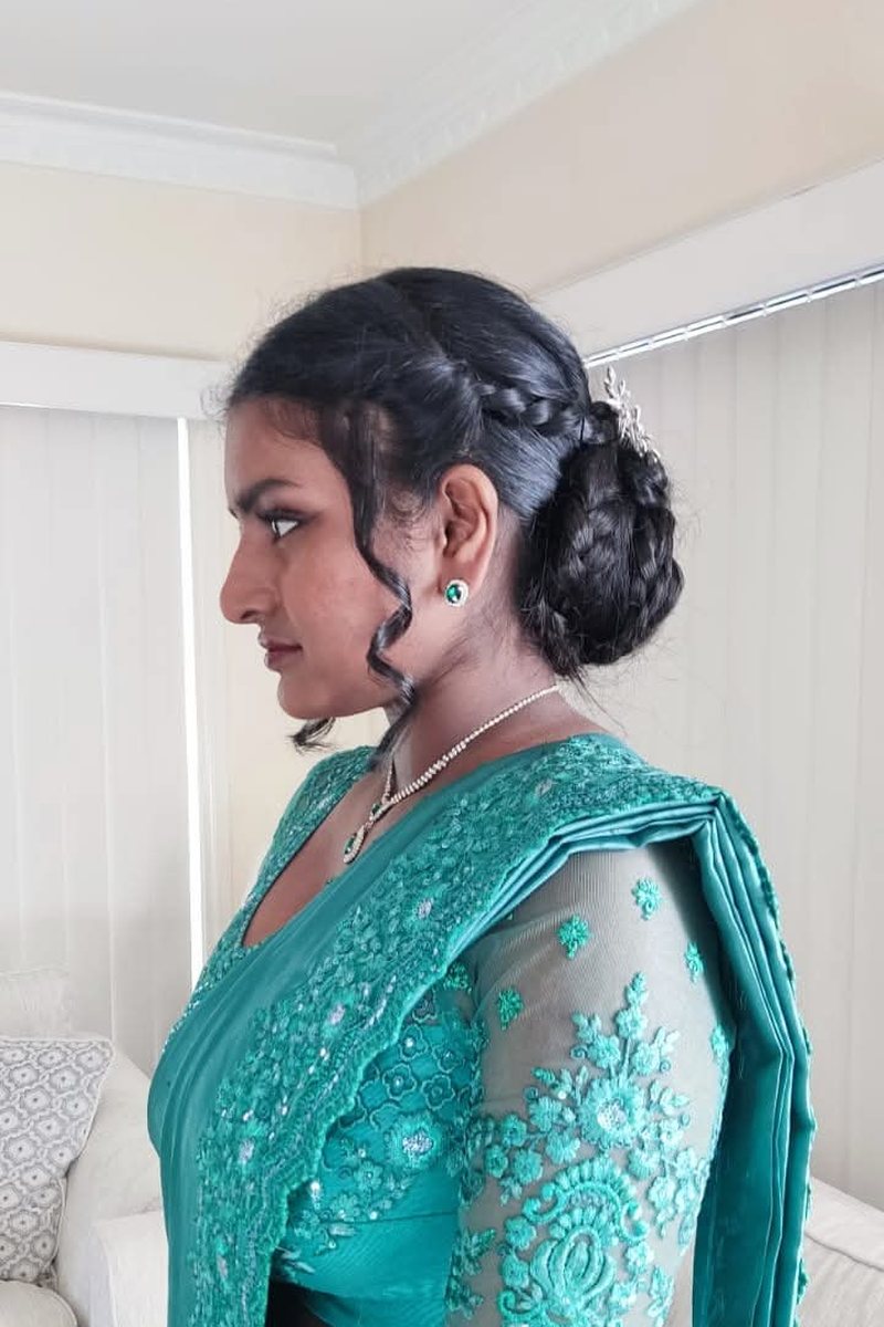 Teal saree with a gold border
