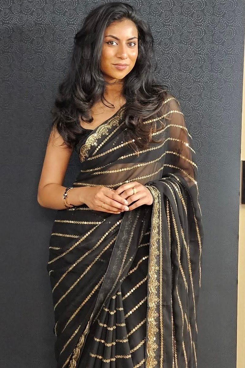 Black saree with gold stripes